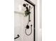 Modern shower with matte black fixtures and marble tile surround at 8132 W Hatfield Rd, Peoria, AZ 85383