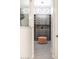 Walk-in closet with custom shelving, drawers, lighting, and a pink ottoman at 8132 W Hatfield Rd, Peoria, AZ 85383