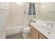 Clean bathroom featuring a shower-tub combo with a curtain, single sink vanity, and light-colored walls at 8270 N Hayden Rd # 2041, Scottsdale, AZ 85258
