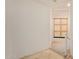 Hallway with a stairway and a decorative window with bamboo shades at 8270 N Hayden Rd # 2041, Scottsdale, AZ 85258