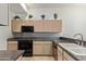 Efficient kitchen featuring neutral cabinets, a black oven, and a deep sink basin at 8270 N Hayden Rd # 2041, Scottsdale, AZ 85258