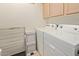Laundry room with washer, dryer, and storage shelving for organized convenience at 8270 N Hayden Rd # 2041, Scottsdale, AZ 85258