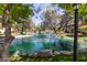 Picturesque pond with fountains and mature trees, creating a serene and inviting outdoor space at 8270 N Hayden Rd # 2041, Scottsdale, AZ 85258
