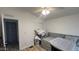 Bedroom features a ceiling fan and access to a storage closet at 9333 E University Dr # 57, Mesa, AZ 85207