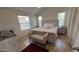 Charming bedroom features natural light, neutral tones, wood-look floors, and stylish furnishings at 9333 E University Dr # 57, Mesa, AZ 85207