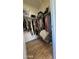 Spacious walk-in closet featuring wood floor, hanging rods, and shelves at 9333 E University Dr # 57, Mesa, AZ 85207