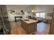 Spacious eat-in kitchen with an island, modern finishes, and easy flow to the cozy living room at 9333 E University Dr # 57, Mesa, AZ 85207