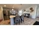 Eat-in kitchen features an island with seating, stainless appliances, and modern finishes at 9333 E University Dr # 57, Mesa, AZ 85207