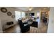 Relaxing living room with light-filled windows, a ceiling fan, and stylish decor and furnishings at 9333 E University Dr # 57, Mesa, AZ 85207