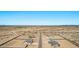 An overhead view of new homes and construction sites in an expansive desert community in Arizona at 9429 W Sandstone Mountain Dr, Casa Grande, AZ 85194