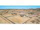 Overhead view of new home sites featuring block wall enclosed yards and desert landscape at 9429 W Sandstone Mountain Dr, Casa Grande, AZ 85194