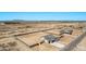 An overhead view of multiple new homes in a new community surrounded by the desert landscape at 9429 W Sandstone Mountain Dr, Casa Grande, AZ 85194