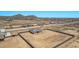 Aerial view of new home construction sites each featuring block wall enclosed yards and streets at 9429 W Sandstone Mountain Dr, Casa Grande, AZ 85194