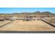Aerial view of homes featuring desert landscape and mountain views at 9429 W Sandstone Mountain Dr, Casa Grande, AZ 85194