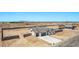 Aerial view of single-Gathering home with a walled-in yard and a three-car garage at 9429 W Sandstone Mountain Dr, Casa Grande, AZ 85194
