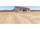 Rear exterior featuring a desert landscaped backyard at 9429 W Sandstone Mountain Dr, Casa Grande, AZ 85194
