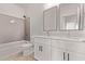Bright bathroom with double sink vanity, quartz counters, tub, and modern fixtures, perfect for daily routines at 9429 W Sandstone Mountain Dr, Casa Grande, AZ 85194