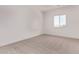 Bright and airy bedroom features neutral carpet and a large window with a view at 9429 W Sandstone Mountain Dr, Casa Grande, AZ 85194