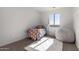 Inviting bedroom with a cozy bed, cheerful decor, and a bright window, perfect for children at 9429 W Sandstone Mountain Dr, Casa Grande, AZ 85194