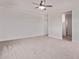 Spacious bedroom featuring plush carpeting, ceiling fan, and neutral color palette, perfect for relaxation at 9429 W Sandstone Mountain Dr, Casa Grande, AZ 85194