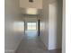 Inviting home entryway with neutral tile floors, clean white walls, and ample natural light at 9429 W Sandstone Mountain Dr, Casa Grande, AZ 85194