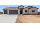Charming single-story home featuring a spacious three-car garage and a low-maintenance desert landscape at 9429 W Sandstone Mountain Dr, Casa Grande, AZ 85194