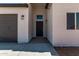 Close-up of front entrance with stylish fixtures and welcoming door at 9429 W Sandstone Mountain Dr, Casa Grande, AZ 85194