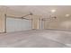 Spacious three car garage with three overhead doors with automatic door openers installed and ready to use at 9429 W Sandstone Mountain Dr, Casa Grande, AZ 85194