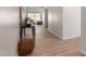 Bright hallway featuring clean white walls, baseboards and stylish flooring at 9429 W Sandstone Mountain Dr, Casa Grande, AZ 85194