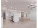 Open-concept kitchen and living area featuring a kitchen island, and modern lighting at 9429 W Sandstone Mountain Dr, Casa Grande, AZ 85194
