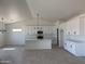 Bright, airy kitchen boasts an island, modern appliances, white cabinets, and an open floor plan at 9429 W Sandstone Mountain Dr, Casa Grande, AZ 85194