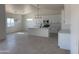 Well lit kitchen features a central island, sleek countertops, stainless appliances, and modern cabinetry at 9429 W Sandstone Mountain Dr, Casa Grande, AZ 85194