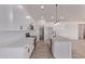 Spacious kitchen featuring a center island, stainless steel appliances, and crisp white cabinetry at 9429 W Sandstone Mountain Dr, Casa Grande, AZ 85194