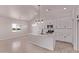 Open kitchen featuring a spacious island, stainless steel appliances, and ample storage with white cabinets at 9429 W Sandstone Mountain Dr, Casa Grande, AZ 85194