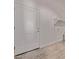 Utility room with a neutral color scheme and minimalist design creates a modern aesthetic at 9429 W Sandstone Mountain Dr, Casa Grande, AZ 85194