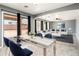 Dining room showcases an open floor plan and sliding door with backyard views at 9735 W Kirby Ave, Tolleson, AZ 85353