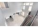 Open concept living area with high ceilings and ample natural light from large windows at 9735 W Kirby Ave, Tolleson, AZ 85353