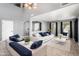 Bright living room with modern decor, high ceilings, and large windows for natural light at 9735 W Kirby Ave, Tolleson, AZ 85353