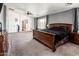 Spacious main bedroom with carpet, ceiling fan, and ample natural light, offering a relaxing ambiance at 9735 W Kirby Ave, Tolleson, AZ 85353