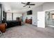 Large main bedroom featuring carpet, ceiling fan, and natural light, offering a serene retreat at 9735 W Kirby Ave, Tolleson, AZ 85353