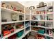 Well-stocked pantry with ample shelving, maximizing storage for all your culinary needs with space for a wide variety of items at 9735 W Kirby Ave, Tolleson, AZ 85353