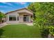 Well-maintained backyard with artificial turf and covered patio, perfect for outdoor entertaining at 10722 W Irma Ln, Peoria, AZ 85373