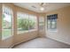 Bright bedroom with tile flooring and large windows with views to the outside at 10722 W Irma Ln, Peoria, AZ 85373