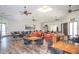 Spacious room with wood floors, tables and chairs, ideal for gatherings and community events at 10722 W Irma Ln, Peoria, AZ 85373
