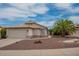 Charming single-story home boasts a two-car garage, desert landscaping, and inviting curb appeal at 10722 W Irma Ln, Peoria, AZ 85373