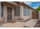 Welcoming front entrance with decorative security door and well-kept landscaping at 10722 W Irma Ln, Peoria, AZ 85373