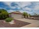 Well-maintained home with a two-car garage and desert landscaping at 10722 W Irma Ln, Peoria, AZ 85373