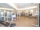 Spacious gym with modern exercise equipment and mirrored walls, perfect for fitness enthusiasts at 10722 W Irma Ln, Peoria, AZ 85373