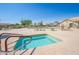 Inviting hot tub next to a spacious pool deck with comfortable seating for ultimate relaxation at 10722 W Irma Ln, Peoria, AZ 85373