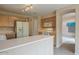 Functional kitchen featuring updated appliances, generous counter space, and access to the living area at 10722 W Irma Ln, Peoria, AZ 85373